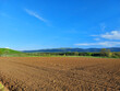 brown field and view to Papuk hills in Slavonia - Croatia
