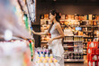 © Heng Yu/Stocksy - Young woman shopping at Supermaket