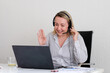© Branislava Zivic Zrnic/Stocksy - Customer support worker assistant computer workplace conversation