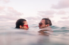 Couple Inside The Sea With Vintage Sunglasses