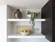 © Raymond Forbes LLC/Stocksy - Minimalist kitchen shelf in Contemporary Home with houseplant