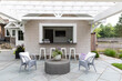 © Raymond Forbes LLC/Stocksy - Residential luxury Home outdoor patio with pergola bar