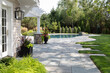 © Raymond Forbes LLC/Stocksy - Residential luxury Home outdoor terrace patio to swimming pool