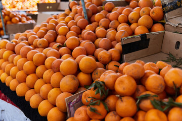 Wall Mural - Oranges on the counter of the authentic Egyptian market. Fresh fruits in the street bazaar
