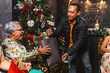 © Leonardo Borges Nuñez/Stocksy - Gift exchange at the Christmas party