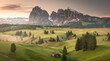© Travelpix/Stocksy - Fog in the meadows of the Alpe di Siusi at sunrise.  Dolomites. (vt)