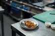 © Alberto Rojas/Stocksy - Udon noodles on plate placed on counter