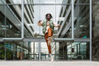 © VICTOR TORRES/Stocksy - Black man jumping near modern building