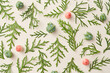 Fir leaves, green cones and paradise apples creating natural pattern