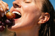 © Studio Firma/Stocksy - Woman Eating Grape