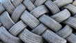 © Tim Booth/Stocksy - Stacked car tyres