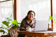 © ByLorena/Stocksy - Hotel Manager Working in Tropical Restaurant