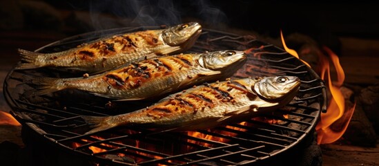 Canvas Print - Three juicy fish are sizzling on a hot grill with flames dancing underneath, creating a mouthwatering aroma. The fish are being cooked to perfection, with their skin crisping up and the flesh turning