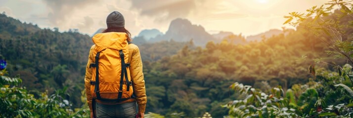 Wall Mural - Adventurous hikers on a mountain journey at sunset, summer trekking and nature exploration together