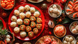 A table is covered in a variety of delicious traditional New Year dishes including fish dumplings and sticky rice cakes.