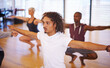 © Mapodile/peopleimages.com - People, dancer and together in studio for training with moving, stretching and balance for exercise with rhythm. Men, women and dancing group with art, creativity and warm up with ballet for workout