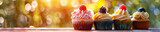 Assorted cupcakes with colorful frosting and berries on a sunlit table