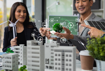 Businessman team brainstorming using tablet, laptop computer for working technology and business,  Renewable energy-based green businesses and global warming. Reduce CO2 emission.