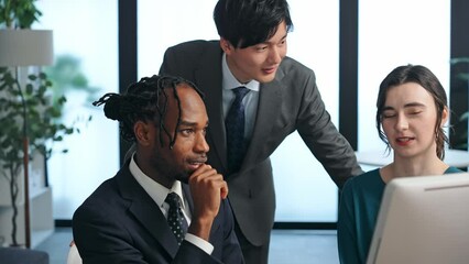 Poster - Multinational businesspeople talking while looking at PC monitor in the lobby. International business.