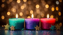 Three Candles Aglow In Different Hues, Embellished With Glittering Stars On Bokeh 