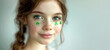 Young Irish girl with clover make up on her face for St. Patrick's holiday
