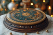 © Romashka - Round golden blue object with a world map or star map printed on it stands on a marble table