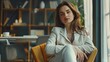 © an - A confident businesswoman sitting on a sofa in the room where she works. The businesswoman has long brown hair. Created with Generative AI.