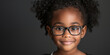 Cute smiling afroamerican girl with eyewear to vision correction. Banner with dark background and copy space.
