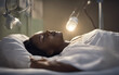 African young woman wearing oxygen mask sleeping in bed, recovering after sickness in hospital ward