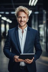 Aufkleber - A man in a suit holding a tablet computer. Perfect for business and technology concepts