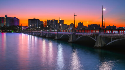 Wall Mural - San Juan Sunrise Cityscape over Puente Dos Hermanos Bridge, opened in 19010, connecting Condado with Old San Juan crossing over the Condado Lagoon in Puerto Rico