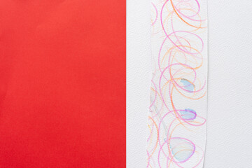 Sticker - abstract background composed of a red paper field, cut paper with cursive lines or loops, and blank space