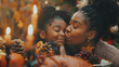 Grateful black girl kisses her mother during Thanksgiving family meal,