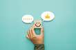 © sichon - Service rating, satisfaction and positive feedback concept. Customer show smile face emoticon on a wooden cube with a like thumb up and icon fivestar in a speech bubble