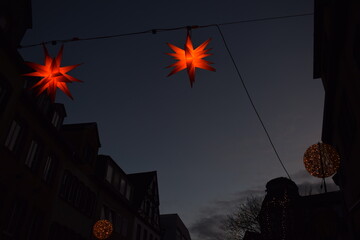 Canvas Print - Star shaped Christmas lights above a street