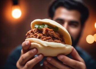 man holding arepa with meat colombian and venezuelan cuisine traditional snack. 