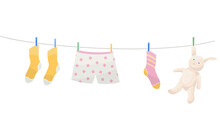 Clothes And Toy Are Dried On A Line After Washing	

