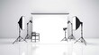 © Fotograf - A photo studio setup with lighting equipment and a chair. Suitable for photography projects