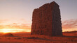 Large monolithic structure in the middle of a desert at sunset