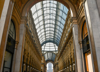 Wall Mural - Low-angle view of Galleria Vittorio Emanuele II (1877), the Italy's oldest active shopping gallery in the city centre of Milan, Lombardy, Italy