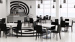 Black and white modern restaurant interior with spiral floor pattern and large windows.