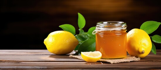 Canvas Print - Golden Honey Jar with Fresh Lemons and Green Leaves - Natural Sweetness Concept