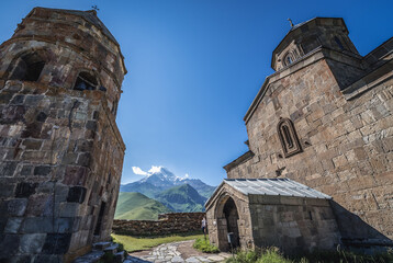 Sticker - Tsminda Sameba - Trinity Church in Caucasus Mountains in Gergeti village near Stepantsminda, Georgia. View with Mount Kazbek