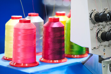 Aufkleber - Spools of color threads closeup, spinning machine