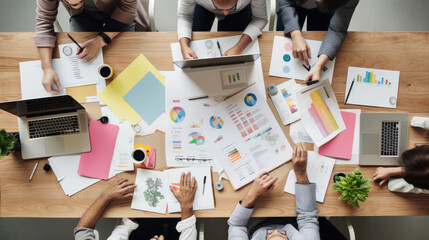 Wall Mural - close-up of a busy brainstorming session with multiple people, colorful note stickers, documents and