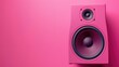 A bold pink speaker stands out against a vibrant pink backdrop, encapsulating modern design