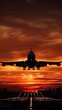 The silhouette of a majestic Boeing 747 stands out against the vibrant hues of the setting sun as it prepares to touch down at Budapest Airport.