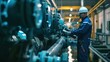 © Naknakhone - A worker at a water supply station inspects water pump valves equipment in a substation for the distribution of clean water at a large industrial estate. Water pipes.