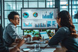 © PHAISITSAWAN - Asian business team sitting in a meeting Graphs on monitor board. Laptop. Modern office.