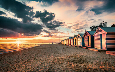 Wall Mural - The sunset view of the Brighton Beach and colorful Brighton Bathing Boxes in Melbourne